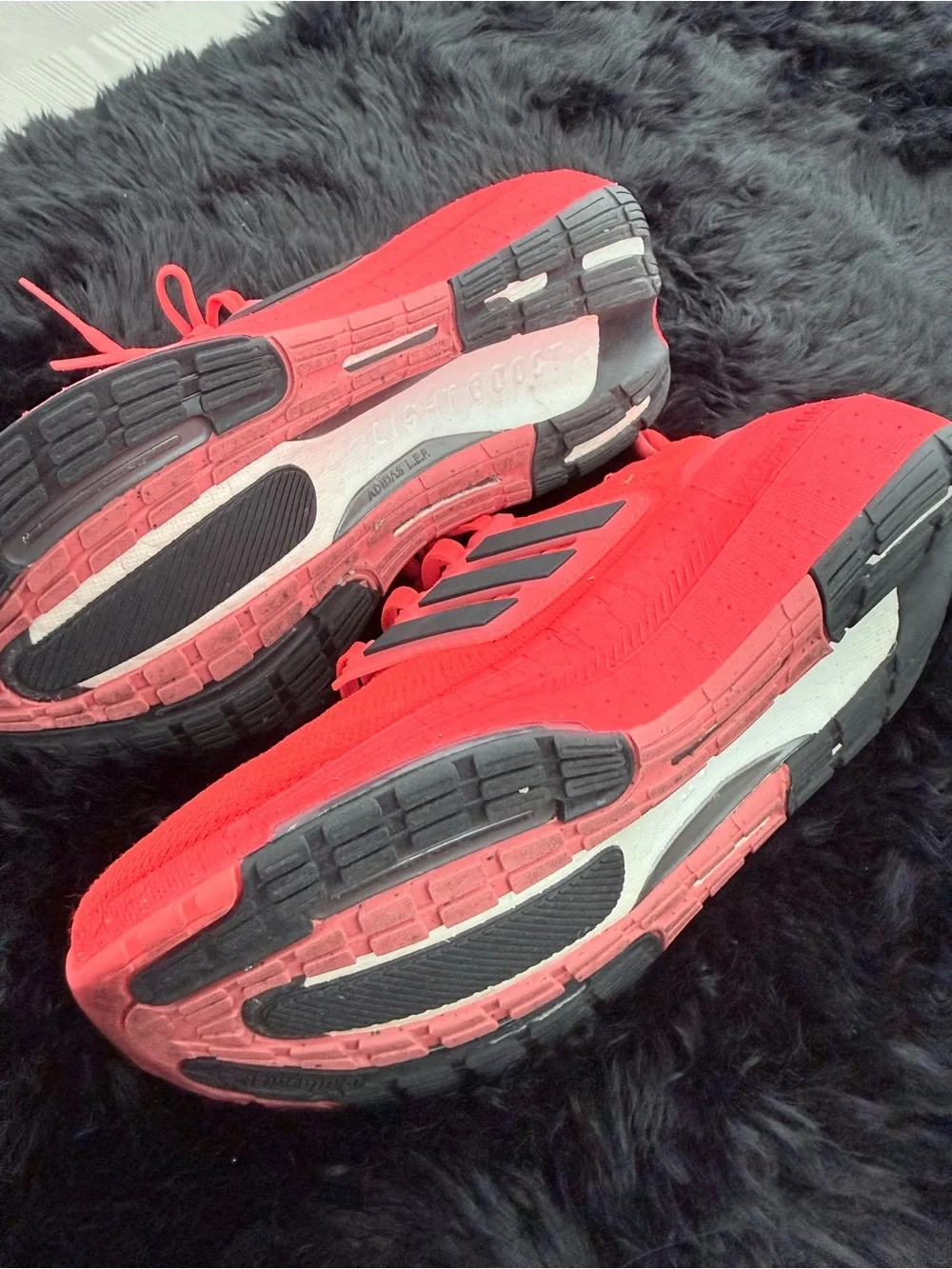 adidas red orange Ultraboost Running Sneakers.